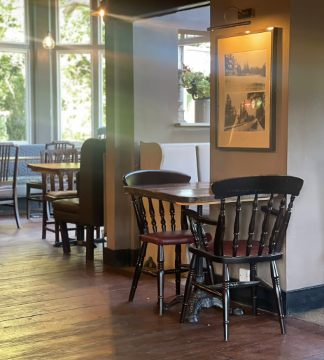 Pub interior with wooden tables and chairs